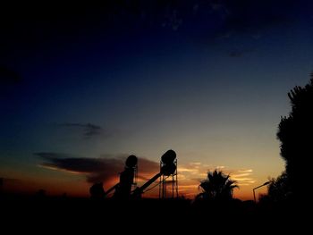 Silhouette people against sky during sunset