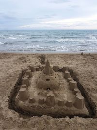 Sand castle on the beach in tuscany