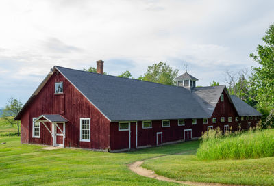 House on field against sky