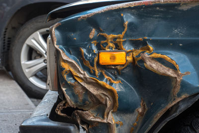 Close-up of rusty abandoned car