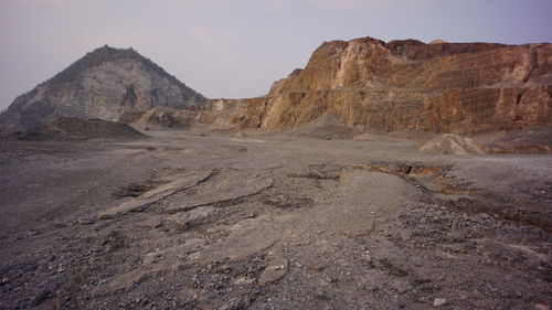 Rock formations in desert against sky