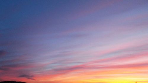 Low angle view of dramatic sky during sunset