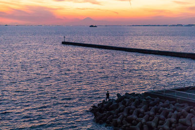 Scenic view of sea against sky during sunset