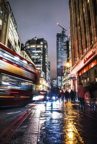 Illuminated city street at night