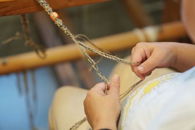 Close-up of person hand holding paper
