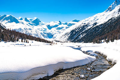 Val roseg, in engadine, switzerland, in winter, with snow-covered cross-country ski slopes.