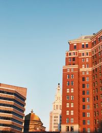 Low angle view of buildings against clear sky