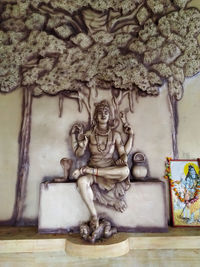 Statues on wall of building
