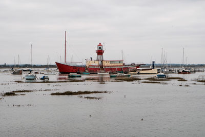 Boats moored at harbor