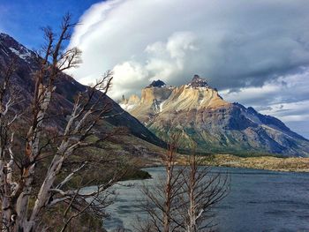 Scenic view of lake against cloudy sky