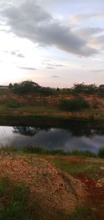 Scenic view of lake against sky during sunset