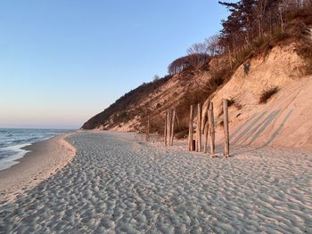 Scenic view of beach against clear sky