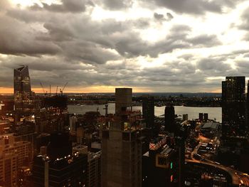 View of cityscape against dramatic sky