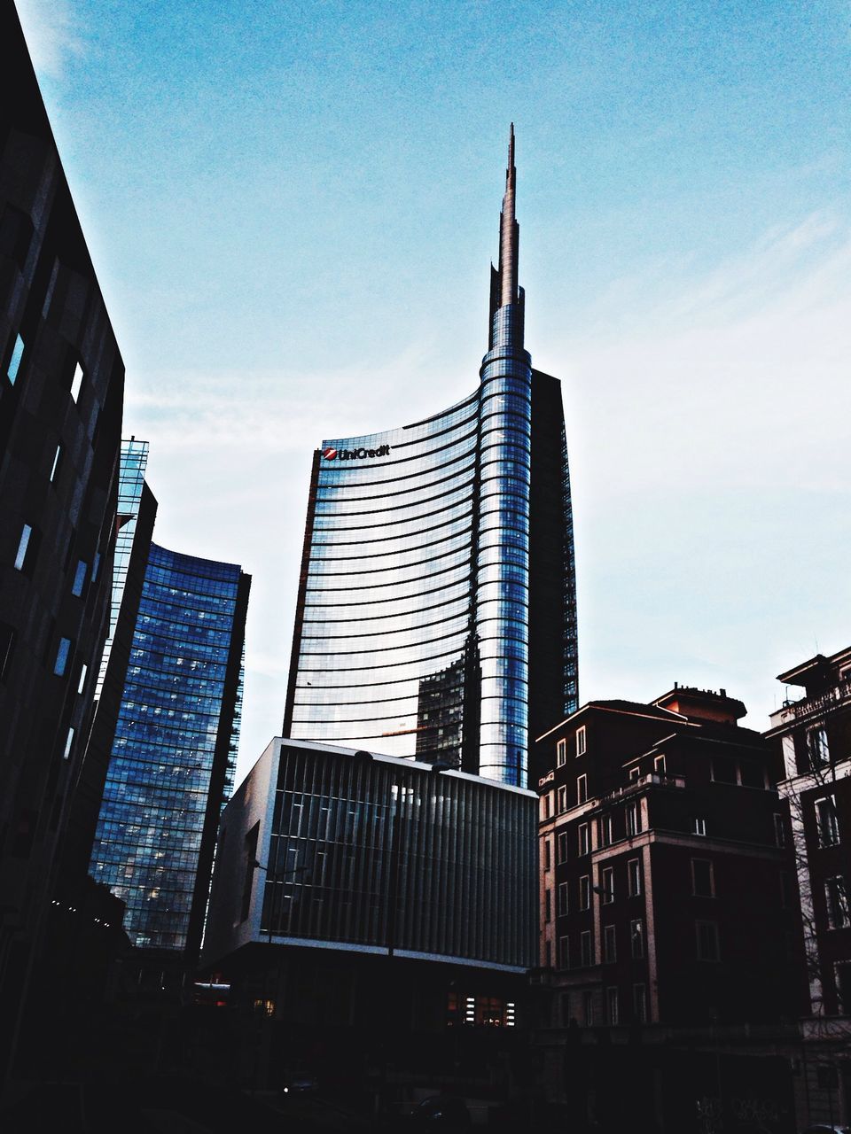 building exterior, architecture, built structure, low angle view, roof, sky, building, city, tower, sunlight, tall - high, clear sky, day, residential building, steps, outdoors, blue, modern, steps and staircases, residential structure