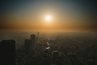 Aerial view of city during sunset