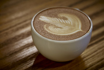 Close-up of cappuccino on table