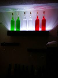 Close-up of illuminated bottles