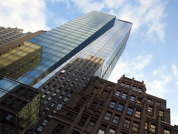 Low angle view of skyscrapers against sky