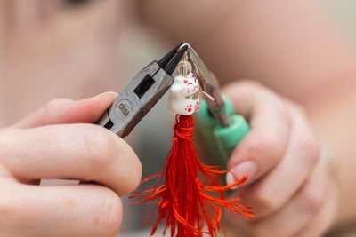 Close-up of hand holding ring