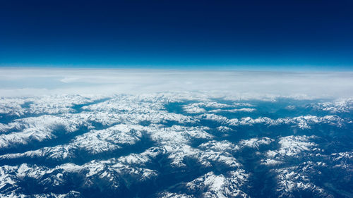 Scenic view of landscape against blue sky