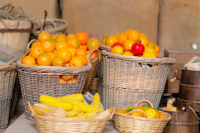 Fruits in basket for sale at market stall