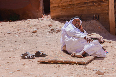 Young man sitting outdoors