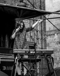 Portrait of woman standing on stage