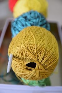 Close-up of wool balls in knitting needle