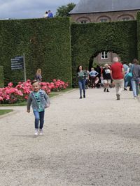 Rear view of people walking outdoors