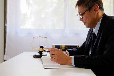 Lawyer working at desk in courtroom