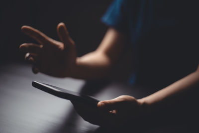Close-up of hand using mobile phone