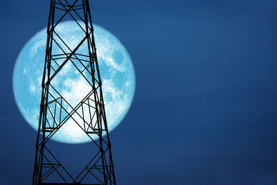 Low angle view of tower against blue sky