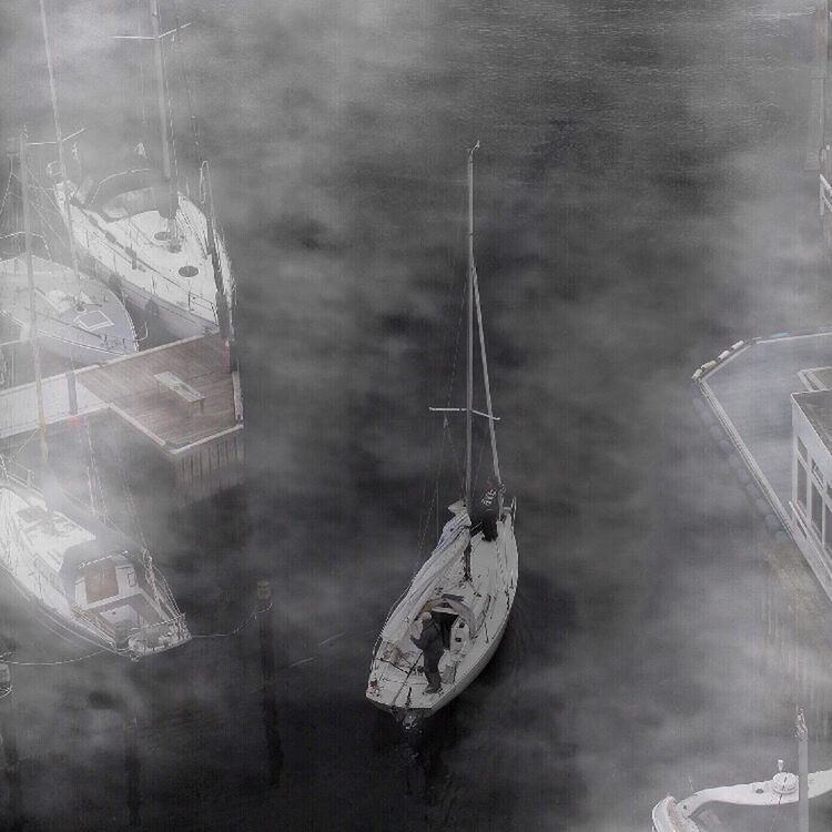 BOATS MOORED IN WATER