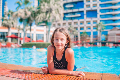 Portrait of smiling girl in swimming pool