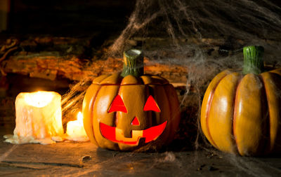 Close-up of pumpkin on wooden table during halloween