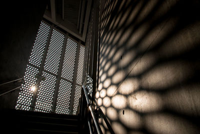 Shadow of person on metal wall