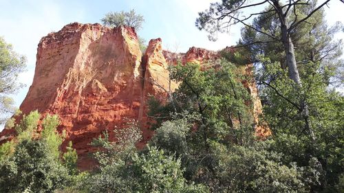 Low angle view of rock formation against sky