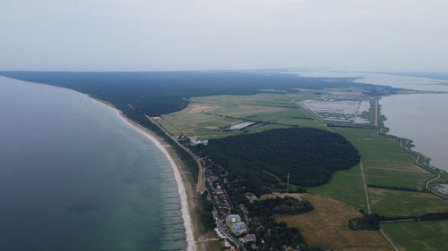 High angle view of river amidst land against sky