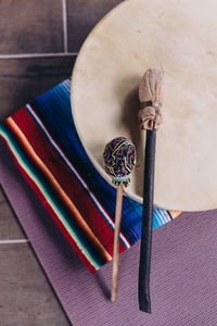 Artisan instrument used at spiritual ceremonies on a colorful surface