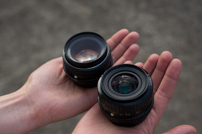 Close-up of hand holding camera