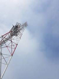 Low angle view of telephone pole against sky