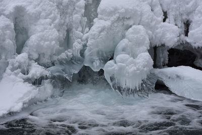 Frozen waterfall over sea