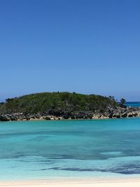 Scenic view of sea against clear blue sky