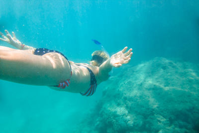 Woman swimming in sea