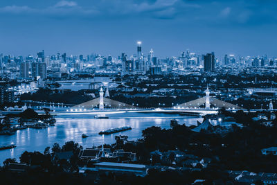 High angle view of illuminated city buildings