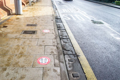 High angle view of arrow sign on road