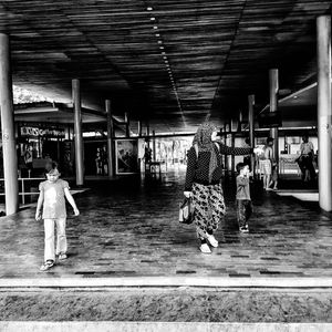 Friends standing on railroad station platform