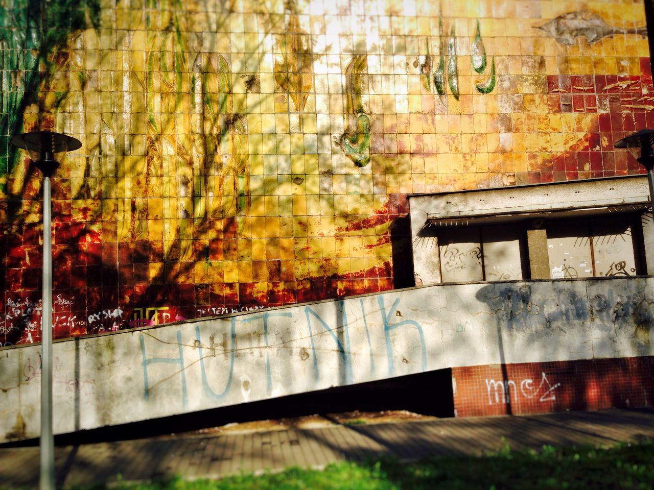 graffiti, built structure, architecture, building exterior, wall - building feature, multi colored, abandoned, no people, outdoors, house, brick wall, weathered, old, wall, damaged, transportation, day, obsolete, deterioration, window