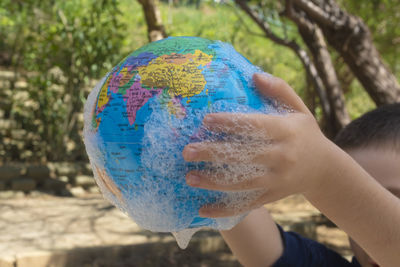 Close-up of hand holding umbrella