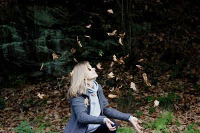 Woman standing on grassy field